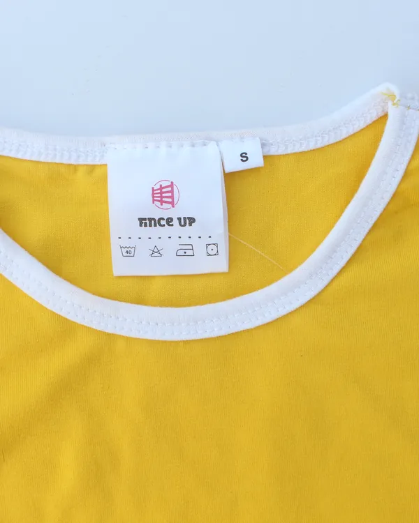 Printed Fince Up neck label inside a yellow tee