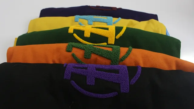 Fince Up varsity jackets in five colors, stacked