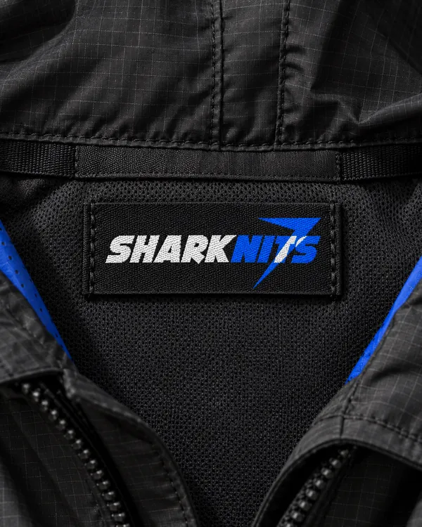 Woven SHARKNITS label inside the collar of the GRID jacket