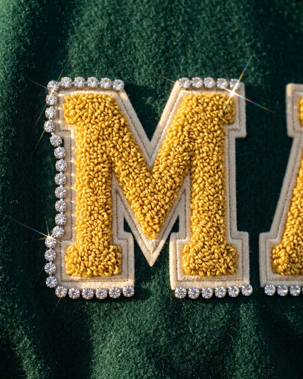 MANE varsity jacket, close up