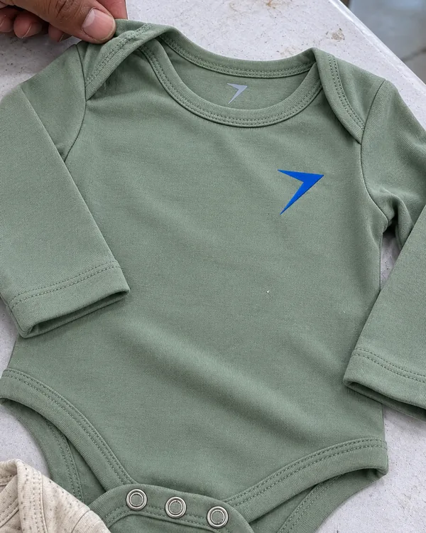 A sage long-sleeve bodysuit laid flat, with an envelope neck, a printed neck label and a blue bolt