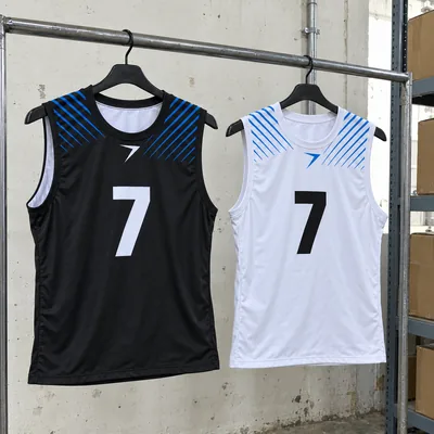 A black 7v7 top with a white 7 and a white one with a black 7, on hangers, with blue stripes at the shoulders