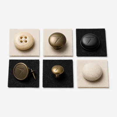 Brass and black buttons and snaps