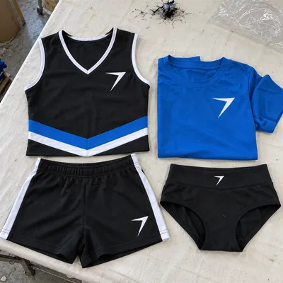 Black practice top, blue tee, black shorts with white stripes and black briefs, each with a bolt