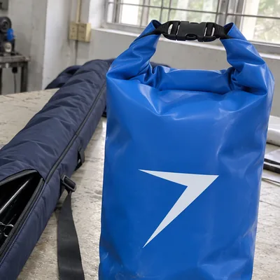 Blue roll-top dry bag with a white bolt and a black buckle