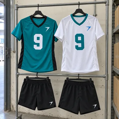 A teal flag football jersey and a white one, each with a 9, above two pairs of black shorts on a rail
