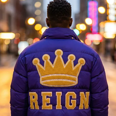 Purple puffer jacket with a crown on the back