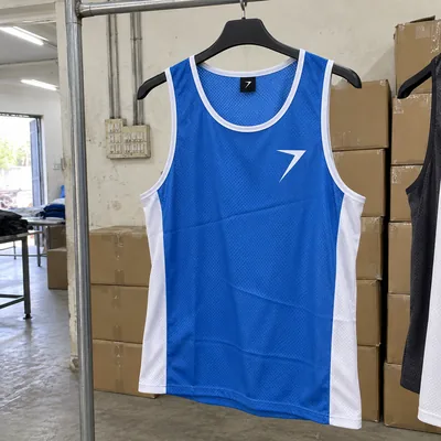 Blue running singlet with white side panels and a white bolt on the chest