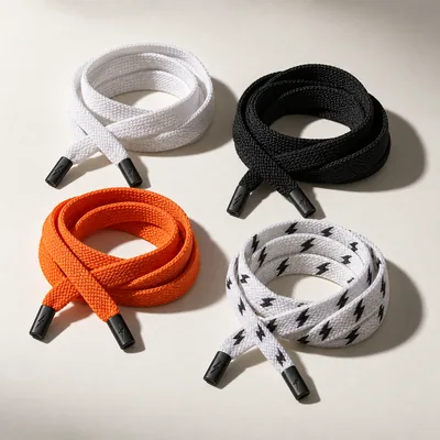 Flat shoelaces in white, black and orange
