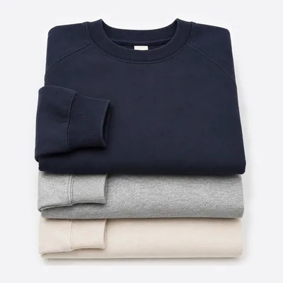 Stack of folded crewneck sweatshirts
