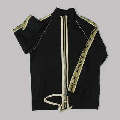 Black track jacket with cream side tape