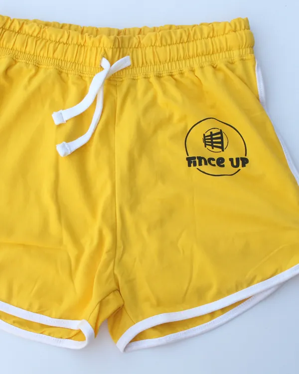 Yellow Fince Up shorts with a printed logo and white binding