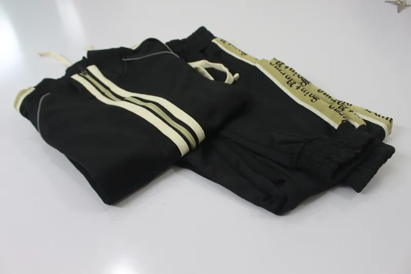 A finished Saint Parma track jacket and pants, folded on a table
