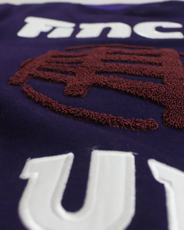 Appliqué letters and chenille crest, close up