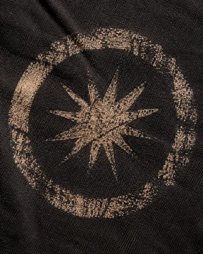 Faded sun print on a dark tee